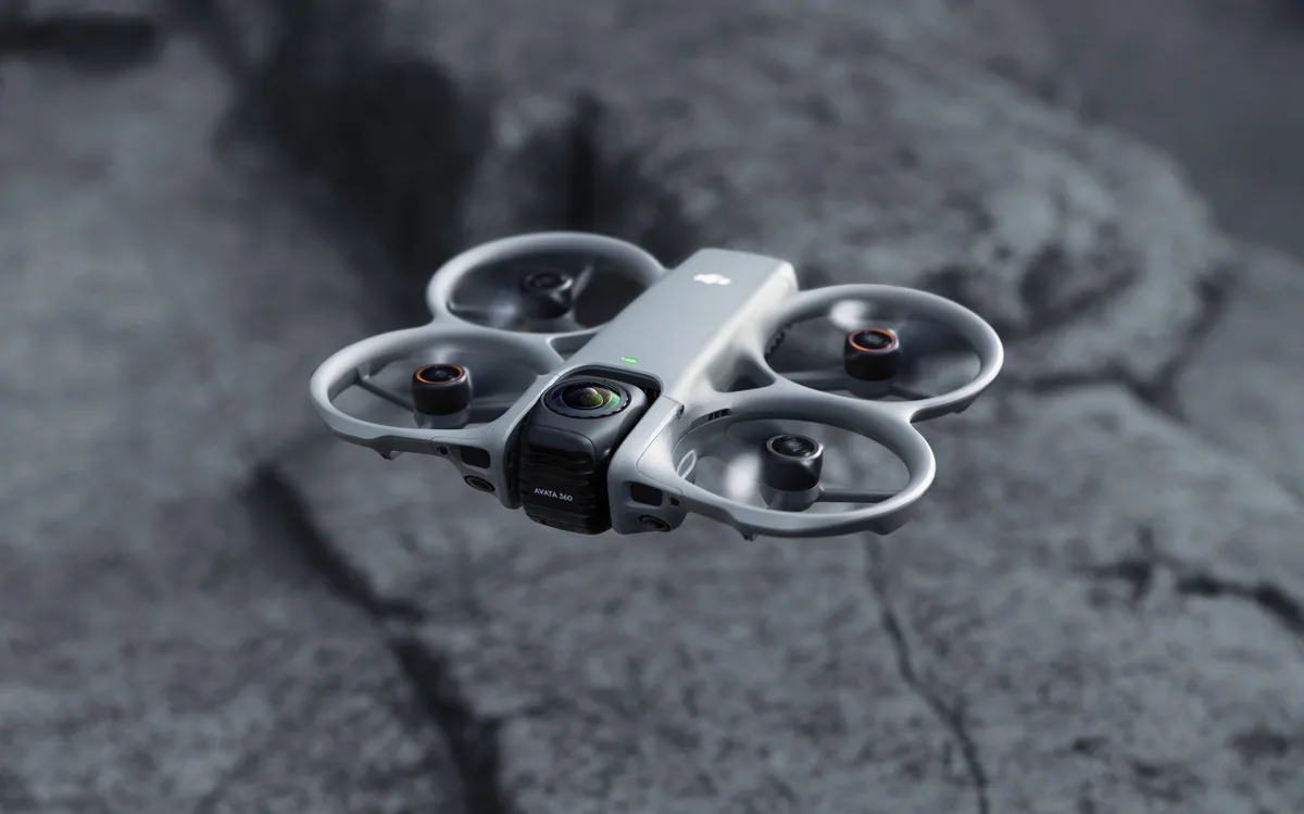 DJI Avata 360 FPV drone flying low over rock