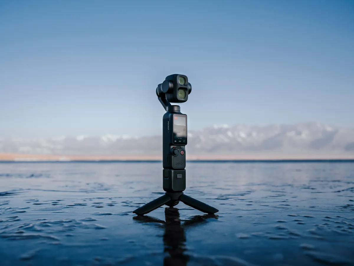 DJI Osmo Pocket 4P pocket gimbal camera on a mini tripod by the sea